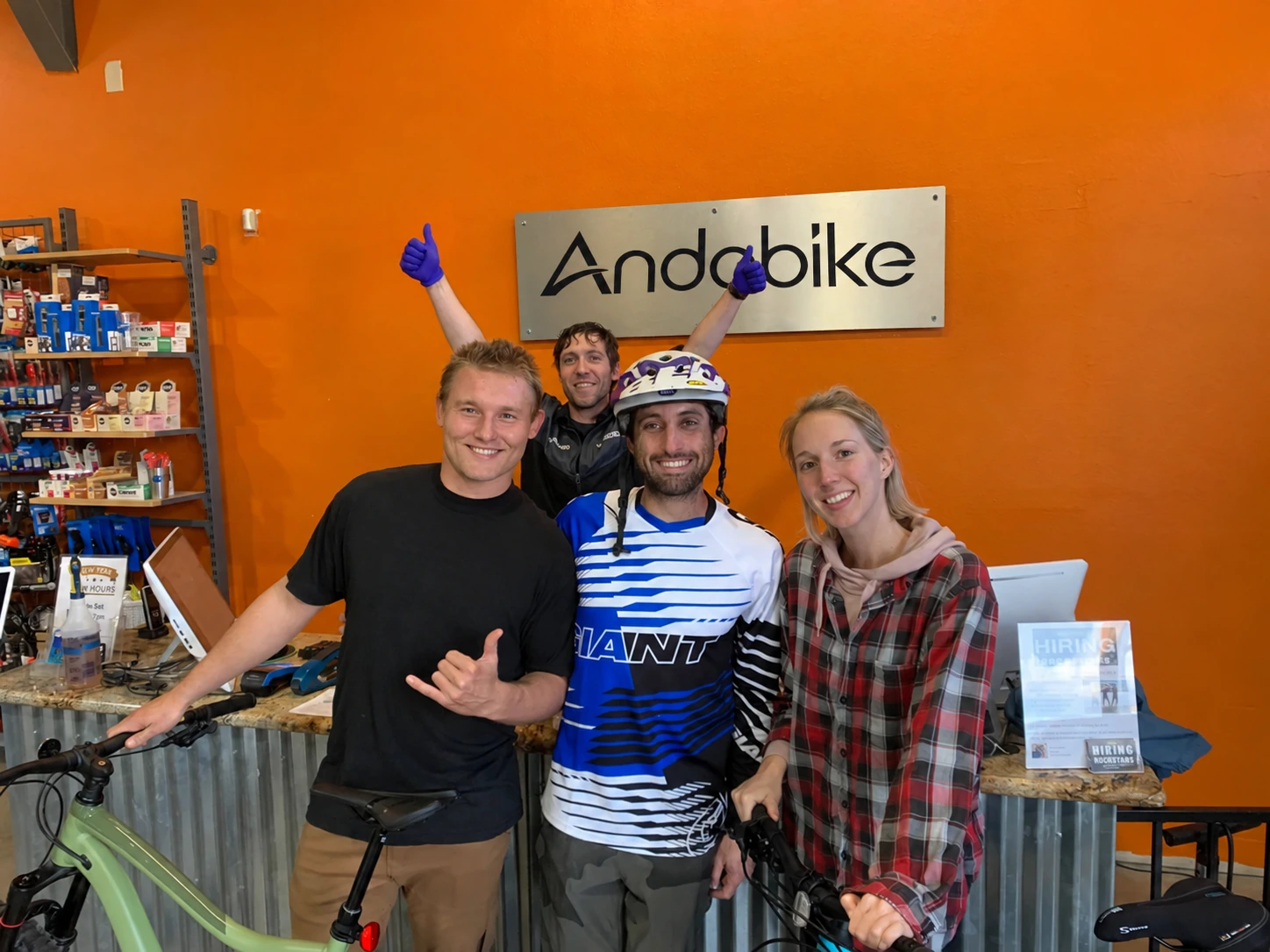 Andobike bicycle shop team standing together